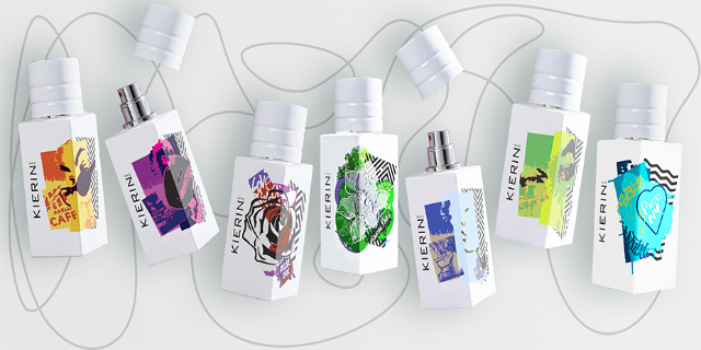 KIERIN travel-size perfume sprays with colorful artwork arranged on a white surface.