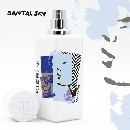 KIERIN Santal Sky perfume with blue Pop Art label, exposed atomizer and cap alongside.
