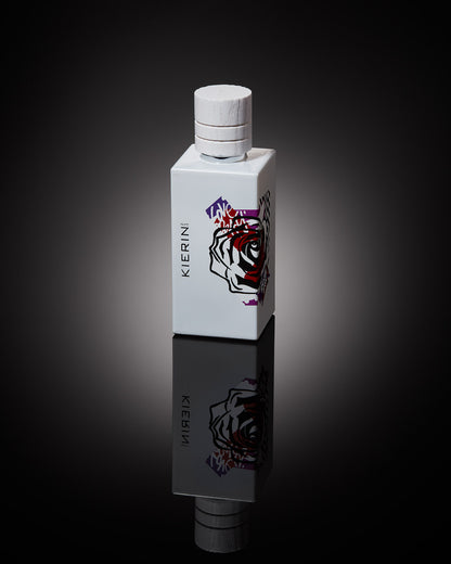 KIERIN Rose Ink perfume bottle reflected on a dark surface.
