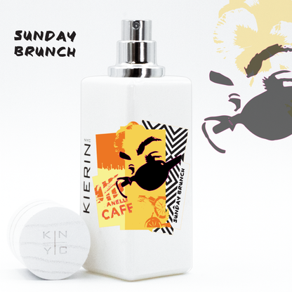 KIERIN Sunday Brunch perfume with yellow Pop Art label, exposed atomizer and cap alongside.