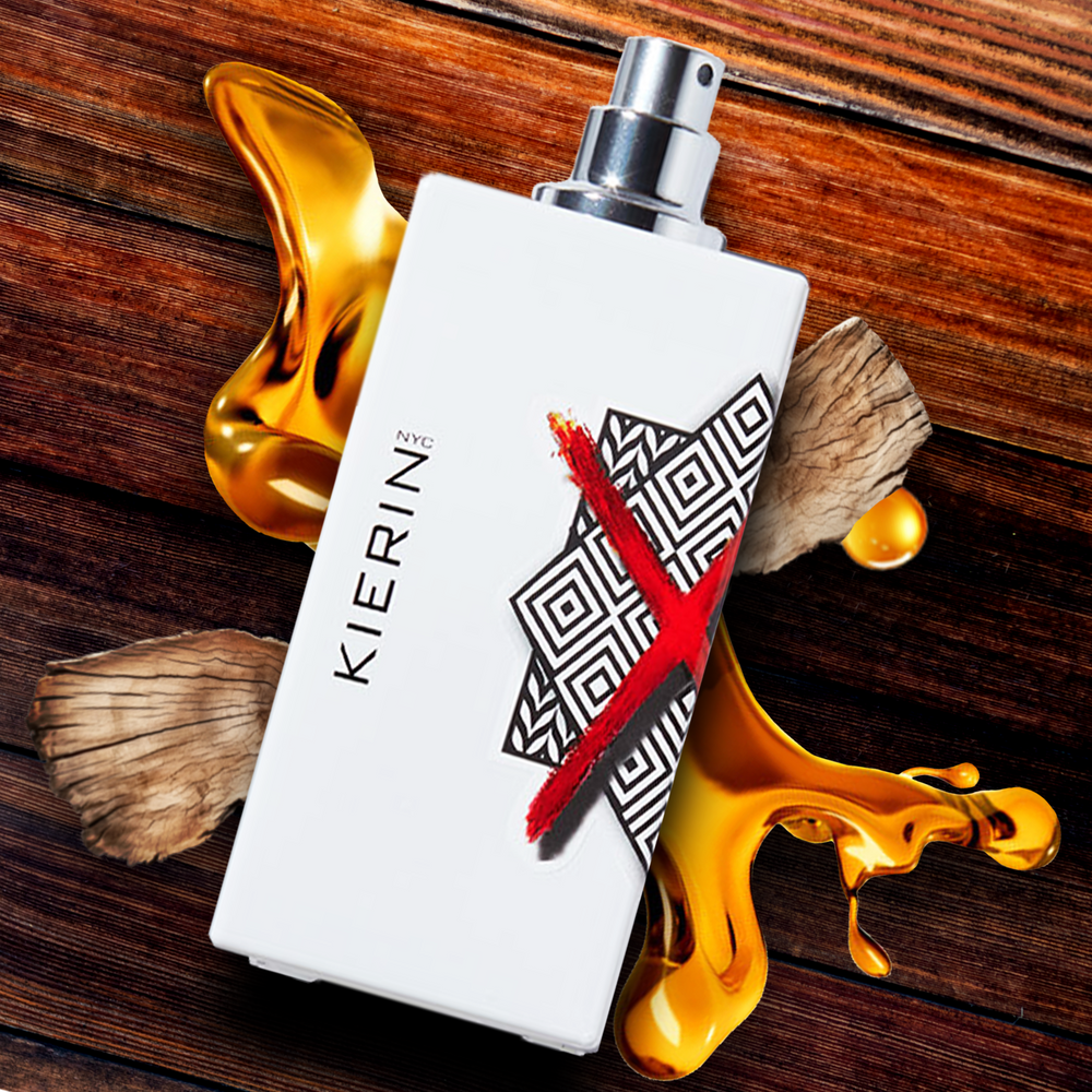 KIERIN ScentXone perfume with exposed atomizer on wood surrounded by honey.